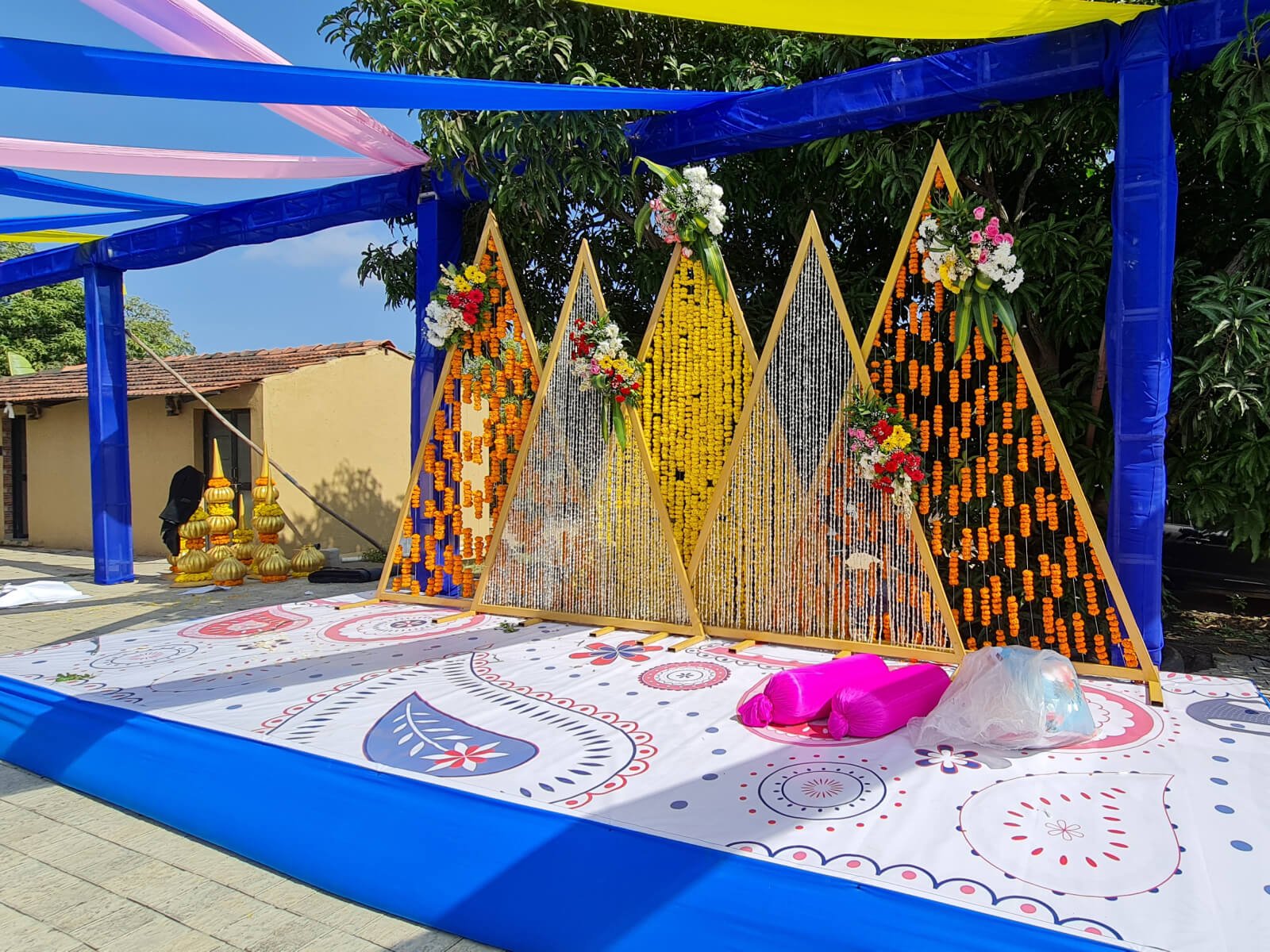 Outdoor event setup with colorful drapes and poolside arrangement, ideal for vibrant celebrations and special events.