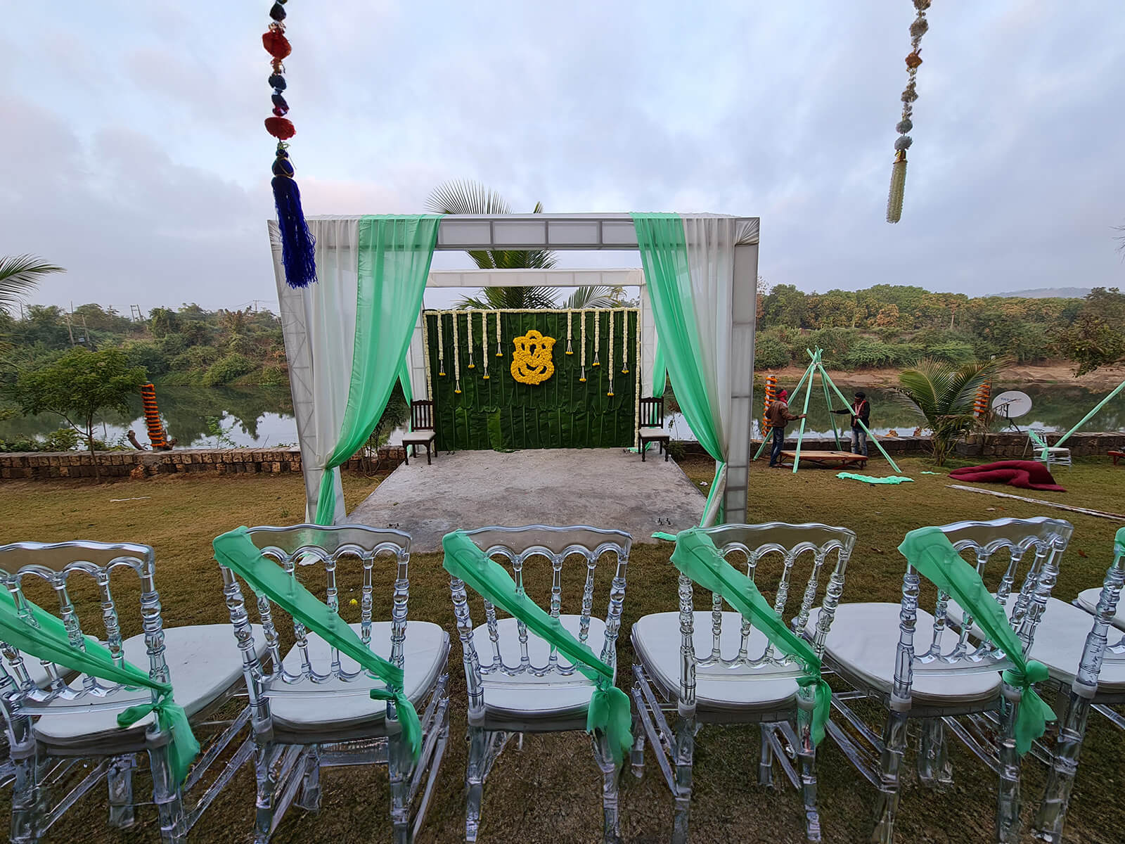 Outdoor event setup with decorated chairs and scenic backdrop, perfect for wedding decoration, haldi ceremony, and destination weddings.