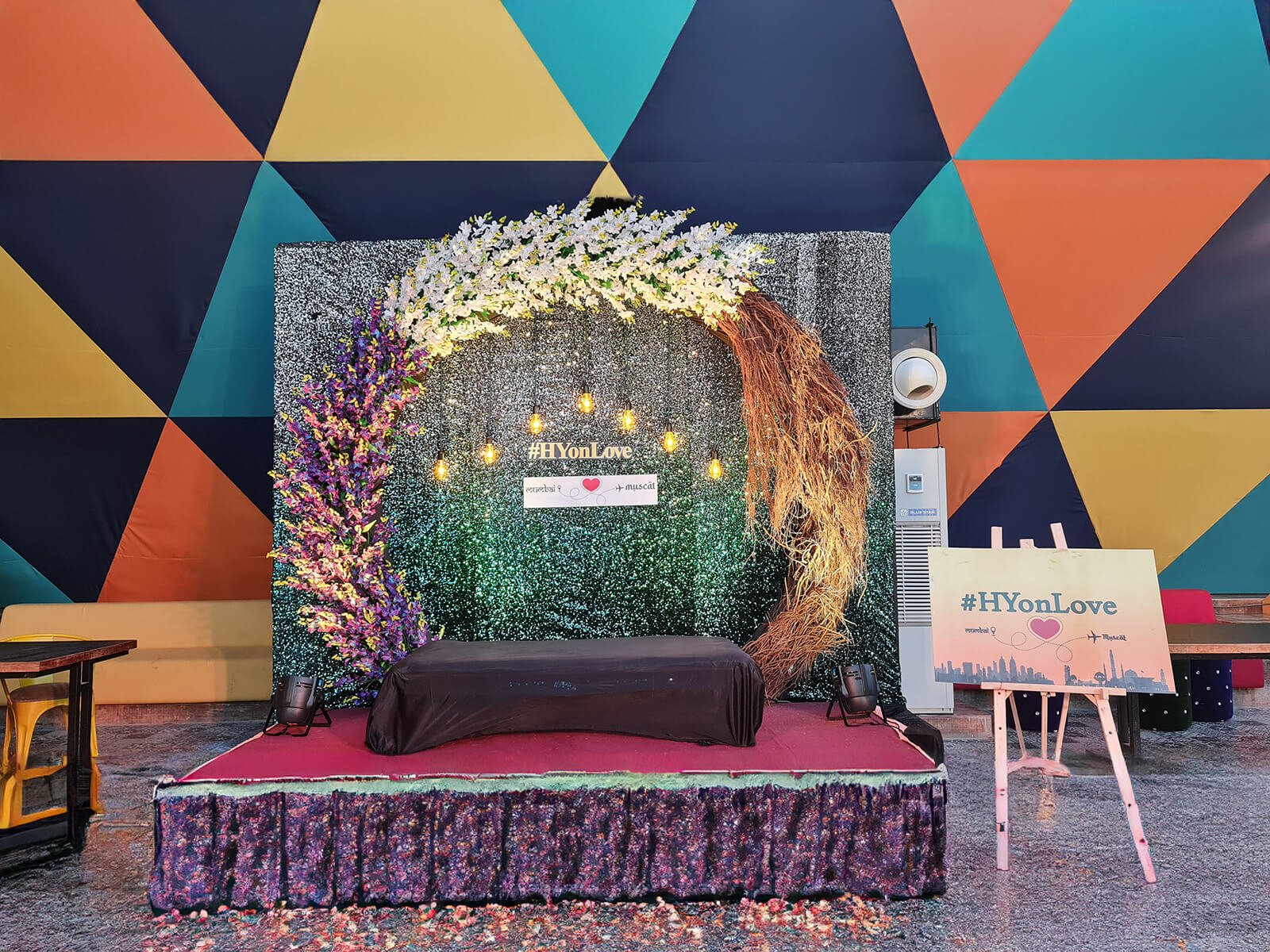 outdoor mehndi event with vibrant decorations and floral arrangements