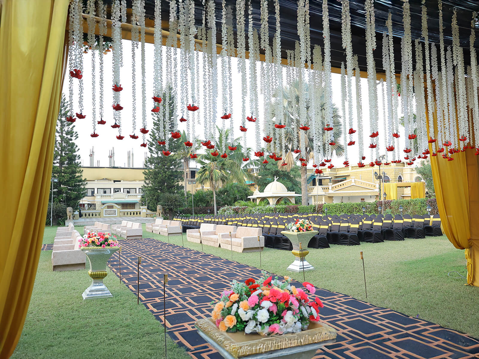 Indoor wedding reception with chandelier lighting and floral decorations