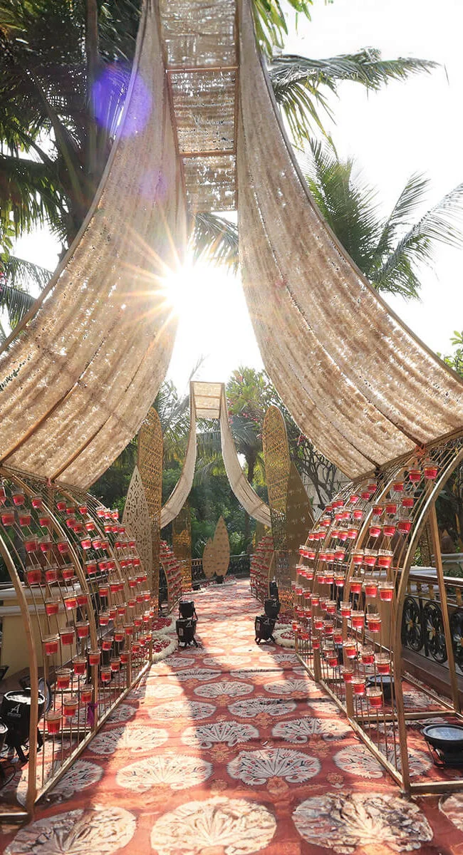 Outdoor wedding event decoration with elegant canopy, floral arrangements, and intricate patterns, ideal for destination weddings and event planning